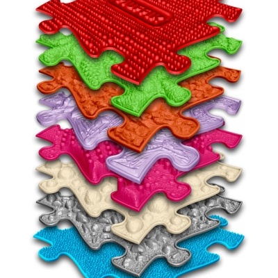 Conjunto colorido de peças de puzzle texturizadas empilhadas