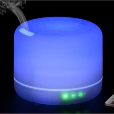 Difusor de aromas eléctrico redondo com luz azul e vapor