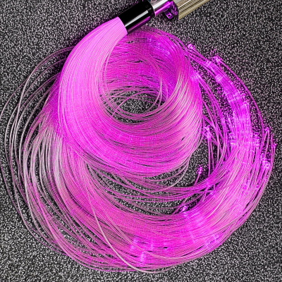 Lâmpada de fibra ótica rosa com filamentos finos enrolados.