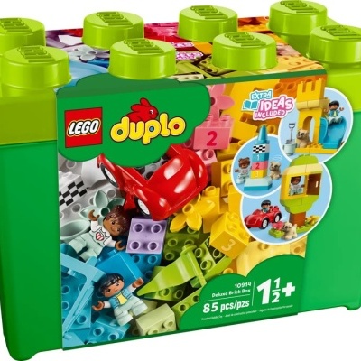 Caixa de Lego Duplo verde com tampa amarela e peças coloridas