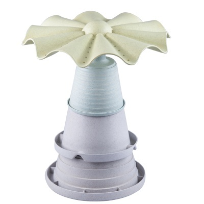 Conjunto de vasos cinza com suporte decorativo amarelo em forma de flor