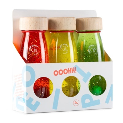 Três garrafas de vidro coloridas em embalagem branca com texto OOOH!