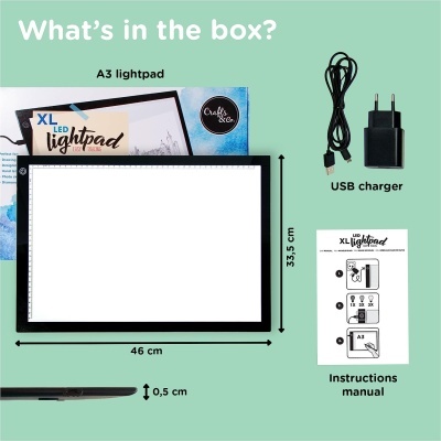 Lightpad XL LED com carregador USB, manual e embalagens em fundo verde claro