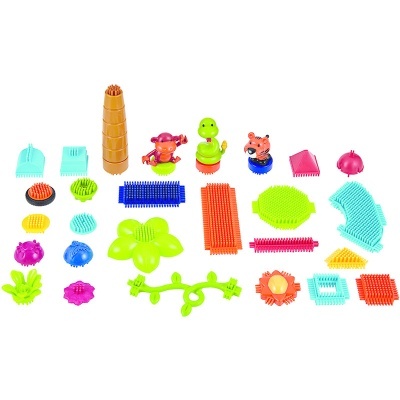 Peças de construção coloridas em plástico com várias formas e figuras de animais