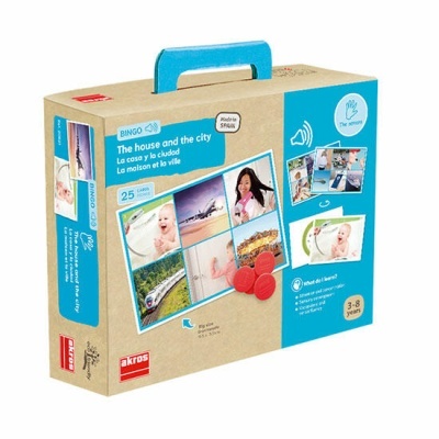Embalagem de jogo educativo 'The house and the city' com alça azul e imagens coloridas.