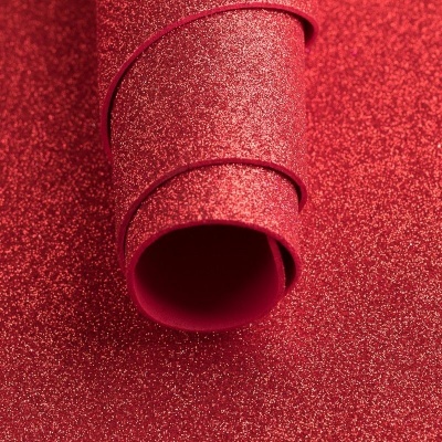 Papel autocolante vermelho brilhante com glitter enrolado