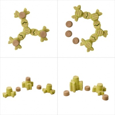 Peças de jogo amarelas com pontos rosa e castanhas em várias formações