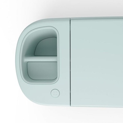 Gadget eletrónico cinza claro com compartimento arredondado e botão circular