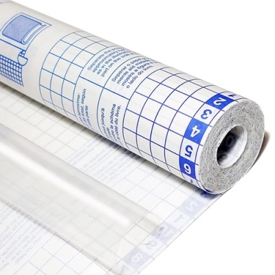 Rolo de película autocolante transparente com grelha azul e texto