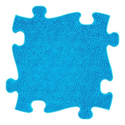 Peça de puzzle azul com textura de pontos