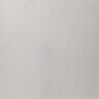 Superfície branca com textura pontilhada em relevo