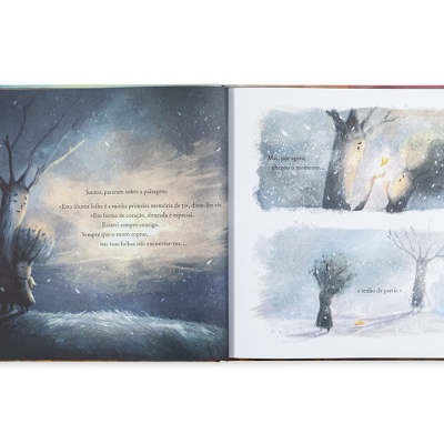 Livro infantil aberto com ilustrações de árvores e texto em português em cenário nevado