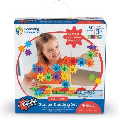 Caixa de set de construção com peças em engrenagem coloridas e imagem de criança a brincar.