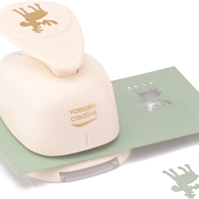 Carimbo bege com desenho de alce e papel verde com padrão impresso