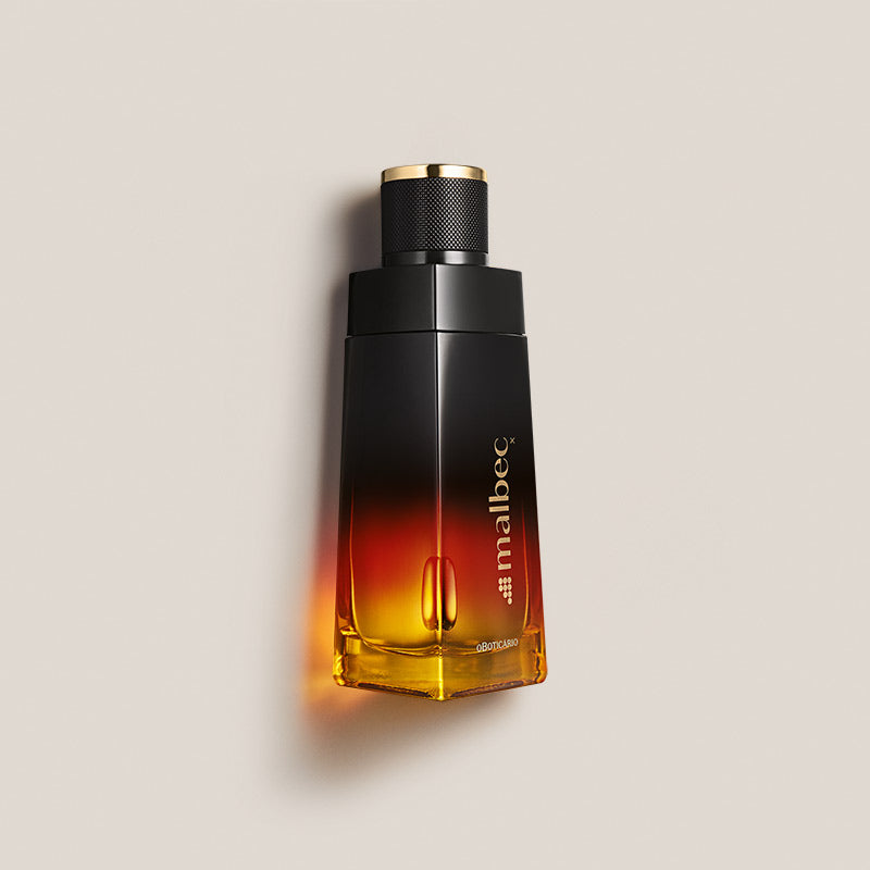 Malbec X Eau de Toilette 100ml Frasco de perfume Malbec em vidro com design em degrade preto e amarelo alaranjado