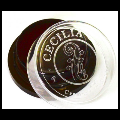 Pote plástico preto com tampa transparente marcada de 'CECILIA' e desenho musical.
