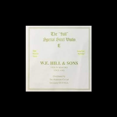 Embalagem com informações de violino em texto dourado