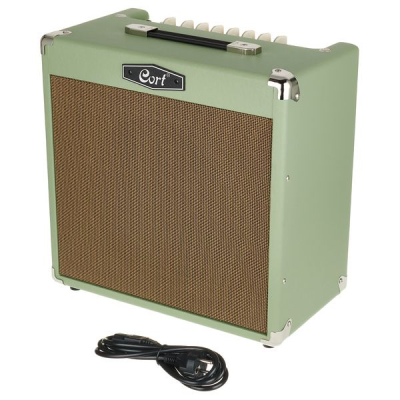 Amplificador de guitarra Cort verde com grelha castanha e cabo preto