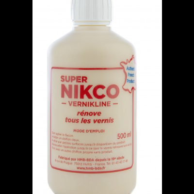 Frasco branco com rótulo vermelho escrito SUPER NIKCO VERNIKLINE renovador de verniz e instruções em francês