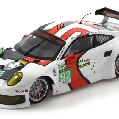 Miniatura de carro de corrida Porsche branco com detalhes vermelhos e pretos.