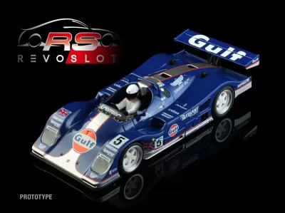 Miniatura de carro de corrida azul com logótipo Gulf e piloto com capacete branco