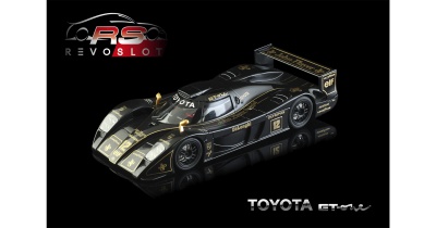 Miniatura de carro de corrida preto com detalhes dourados e várias inscrições