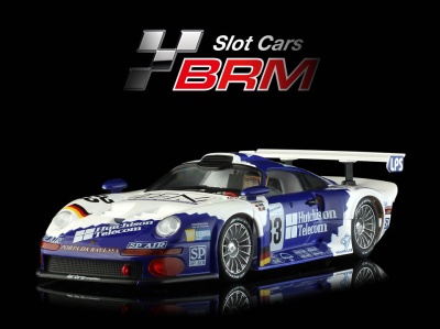 Carro de slot racing azul e branco com logos Hutchison Telecom e número 33