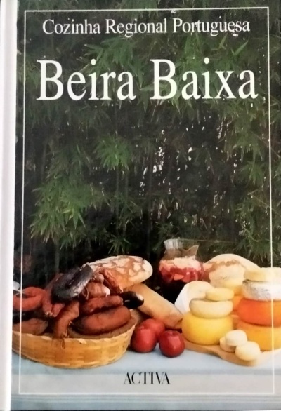 Capa de livro com imagens de pão, enchidos, queijos, tomates e jarro com líquido vermelho.