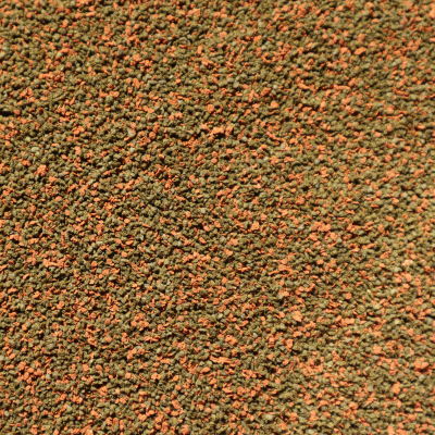 Textura granular com grânulos verdes e laranja misturados
