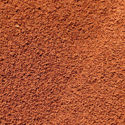 SuperfÃ­cie granulada castanho avermelhado texturada