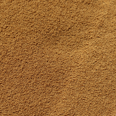 Textura fina e granulada castanha clara em close-up