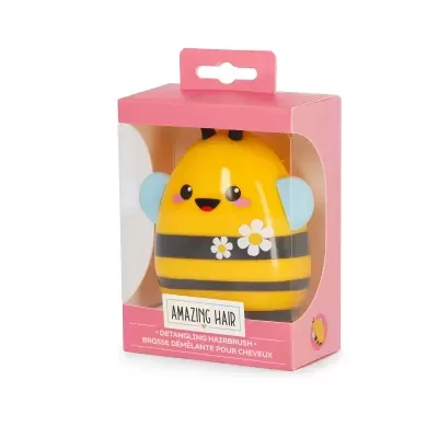 Escova de cabelo amarela em forma de abelha numa caixa rosa com texto