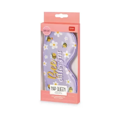 Máscara de dormir roxa com padrão de flores e abelhas na embalagem cor de rosa.