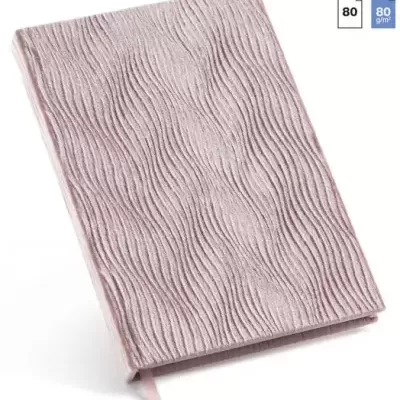 Caderno rosa com capa texturizada e padrão ondulado