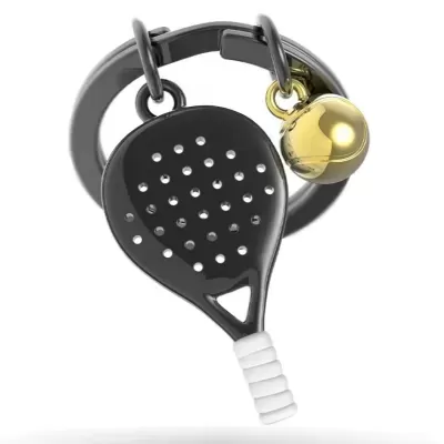 chaveiro em formato de raquete de padel com pequeno sino dourado