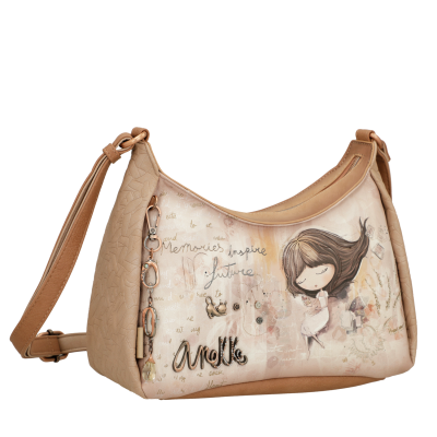 Mala de ombro bege com desenho de menina e texto inspirador