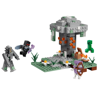 Conjunto de blocos de construção com criaturas e estrutura cinzenta e verde.