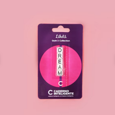 Marcador de livro com letras D R E A M C em embalagem roxa e rosa