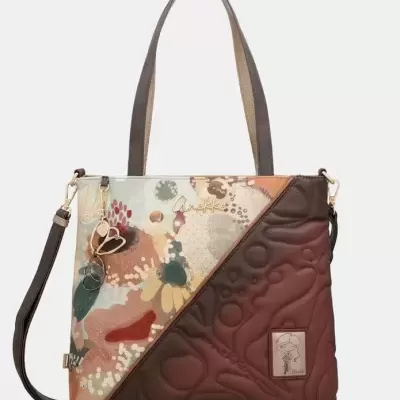 Mala Anekke com padrão floral colorido e textura acolchoada castanha.