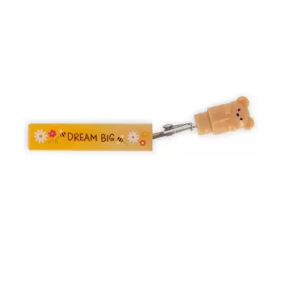 Prendedor de cabelo amarelo com texto DREAM BIG e urso de plástico