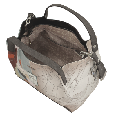 Mala de couro colorida com padrões abstratos e interior forrado com texto Anekke.