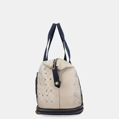 Mala de mão bege com padrão e alças pretas vista lateral