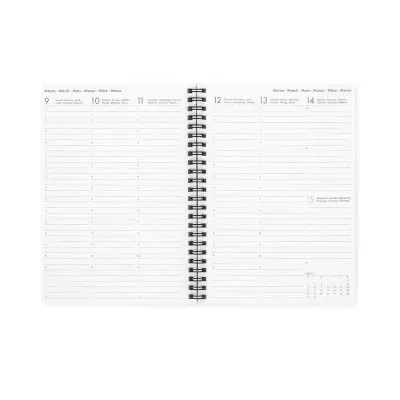 Agenda semanal com encadernação espiral aberta nas páginas 9 a 15 de março