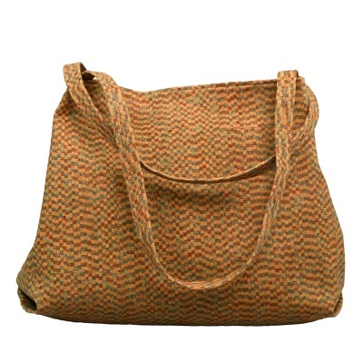 Mala de tecido colorida com padrão geométrico