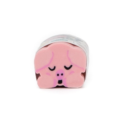 Objeto em formato de cabeça de porco cor de rosa com olhos fechados