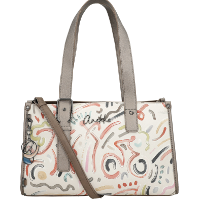 Sacola de mão creme com padrão abstrato colorido e alças castanhas