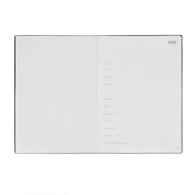 Agenda aberta no ano de 2026 com páginas para informações pessoais