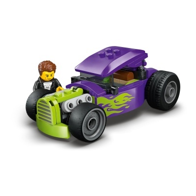 Carro de blocos de montar roxo e verde com figura amarela
