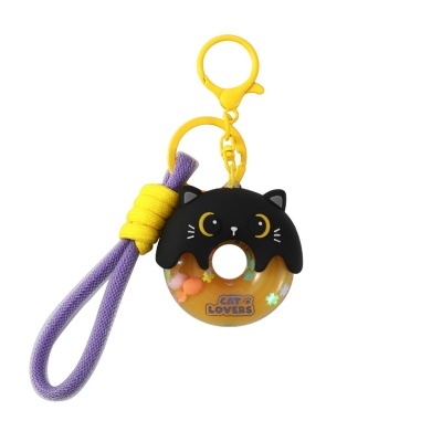 Chaveiro donut com rosto de gato preto e cordão roxo