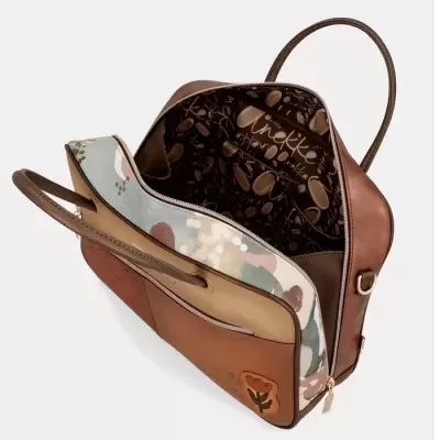 Mala de senhora castanha e bege com padrão floral e interior estampado com texto